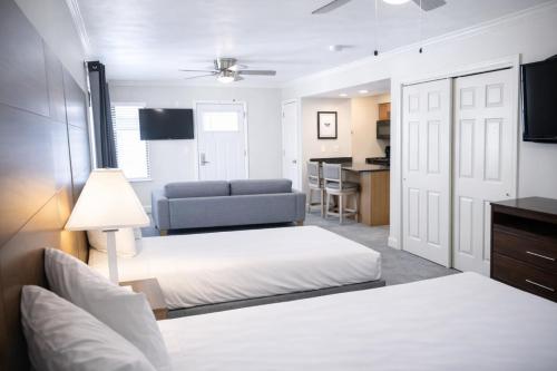 a bedroom with a bed and a living room at Annabell Gardens in Lincoln