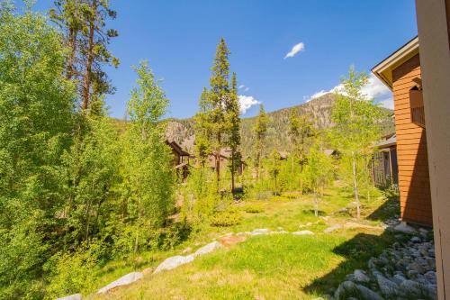 a view of a yard with trees and a house at Settlers Creek 6514 by SummitCove Lodging in Colorado in Keystone