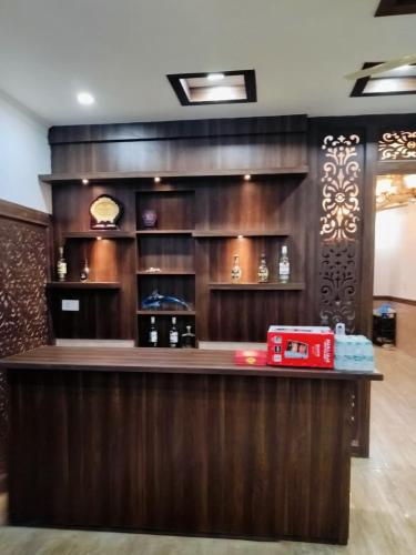 a bar in a restaurant with a counter top at Green Haven Farm & Events in Bhundsi