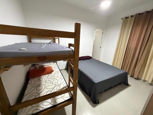 a bedroom with two bunk beds in a room at chácara 3A-2 in Pôrto Feliz