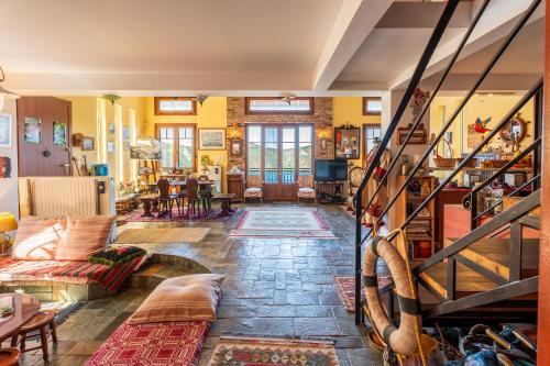 a living room with yellow walls and a staircase at Heritage Ridge in Skroponeria