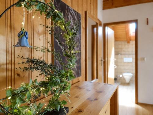 a bathroom with a wooden counter with a potted plant at Ferienwohnungen Stecher in Bad Endorf