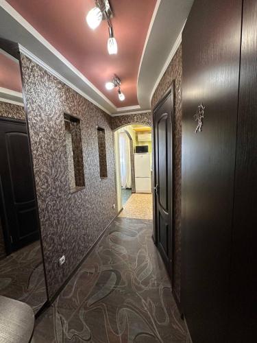 a hallway with a door and a room with a hallwayngthngthngthngthngth at Central Comfort in Konotop