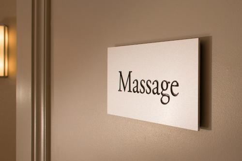 a sign on a wall with the word message at Hotel Monge in Paris
