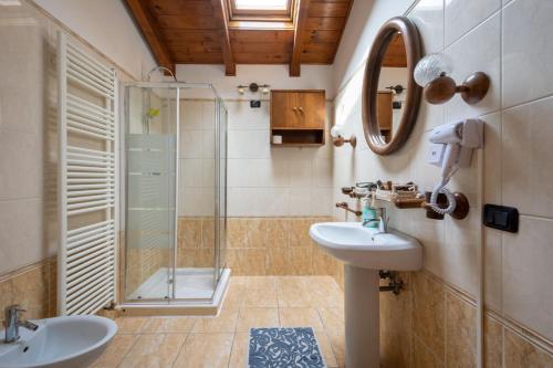 a bathroom with a sink and a shower at Jolly Private Room in Marghera