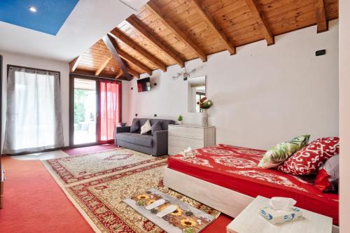 a bedroom with a large bed and a couch at Jolly Private Room in Marghera