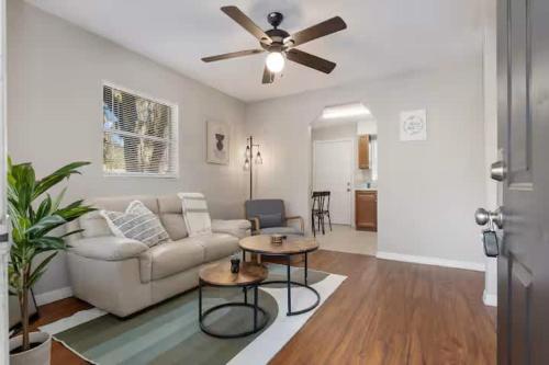 a living room with a couch and a ceiling fan at Silver Springs Retreat in Silver Springs