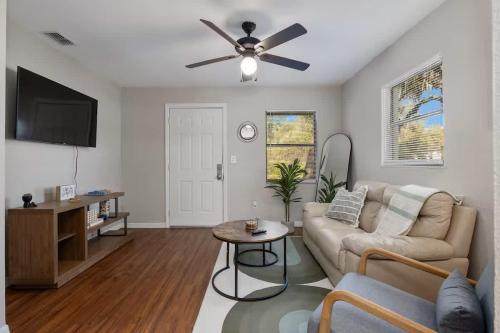a living room with a couch and a ceiling fan at Silver Springs Retreat in Silver Springs