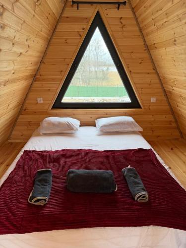 a large bed in a room with a window at Lake Cottages in Grigoleti