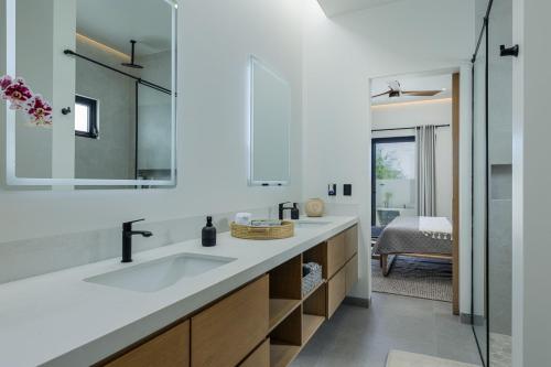 a bathroom with a sink and a mirror at Luxury Villa With Pool in Los Barriles