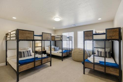 a room with four bunk beds in it at Royal Rock Adventures in Washington