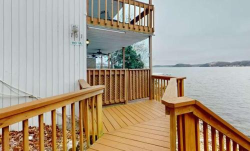 a porch of a house with a view of the water at Lake Front Lookout in Lake Ozark