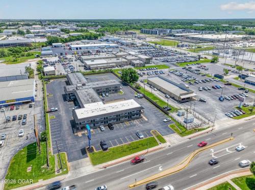 an aerial view of a parking lot at Super 7 inn in Joplin