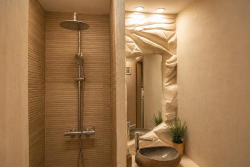 a bathroom with a shower with a toilet and a sink at VERADO by A&D Properties in Porto Rafti