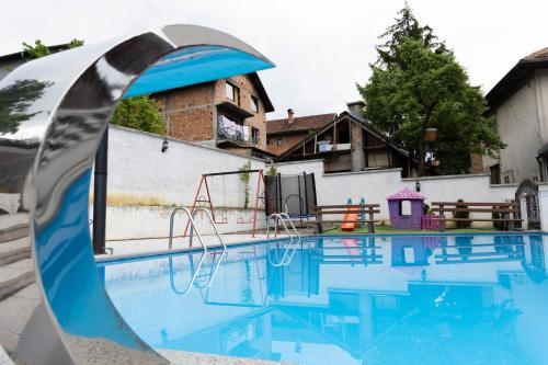 an empty swimming pool with a metal object next to it at Lumina Residence in Sarajevo