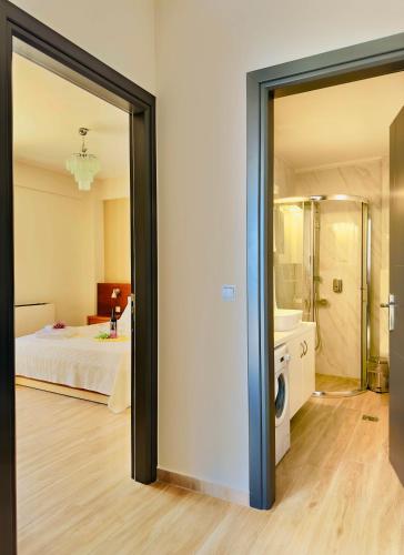 an open door to a bedroom with a bed at Sea Sparkle 1a in Preveza