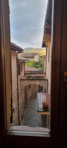 a view of an alley from a window of a building at Domus Hispellum in Spello