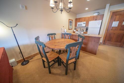 a dining room table and chairs in a kitchen at Red Hawk Lodge 2297 by SummitCove Lodging in Colorado in Keystone