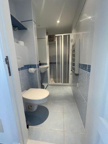 a bathroom with a toilet and a walk in shower at Casa Elite in Calpe