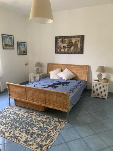 a bedroom with a large bed in a room at Villa 4 Rose in Sant'Angelo D'Ischia