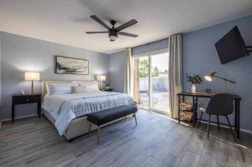 a bedroom with a bed and a ceiling fan at Chandler Galveston in Chandler