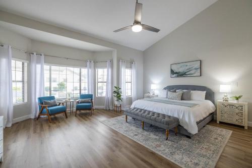 a bedroom with a bed and a table and chairs at Gilbert Willow Tree in Gilbert