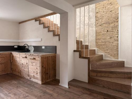 a kitchen with a staircase in a house at Ancona design apartment in Ancona