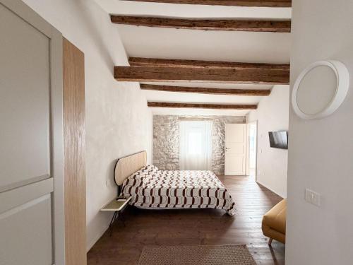 a bedroom with a bed in the middle of a room at Ancona design apartment in Ancona