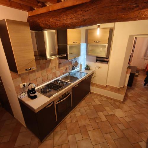 an overhead view of a kitchen with a stove at Tuscan Sunsets Tramonti Toscani in Fauglia