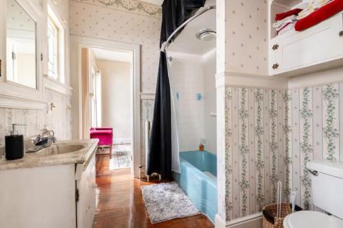 a bathroom with a sink and a toilet at Cozy Cape Cod Bungalow King Queen WD Full Kitchen Wifi Desk in York