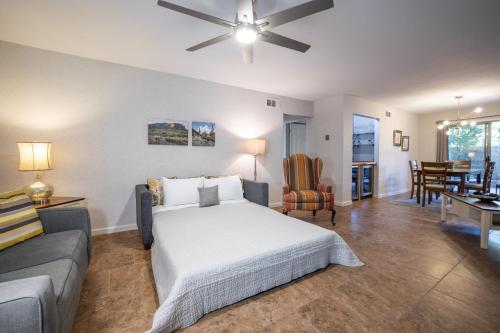 a bedroom with a bed and a living room at Scottsdale Miller in Scottsdale