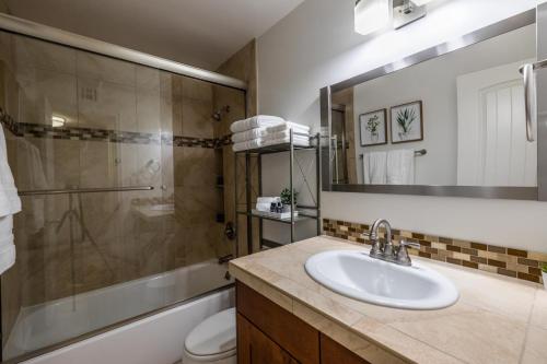 a bathroom with a sink and a shower and a toilet at Scottsdale Orange Blossom in Scottsdale