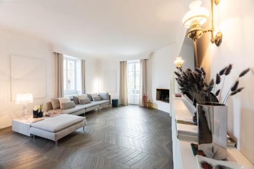a living room with a couch and a table at Uno - Via Loveno, Menaggio by LoveComo in Menaggio