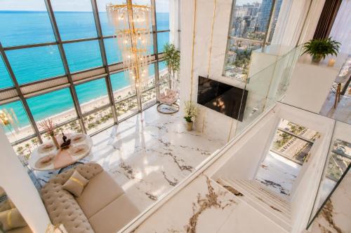 a living room with a view of the ocean at Penthouse Panorama Luxury Sea View Premium Stay in Batumi in Batumi