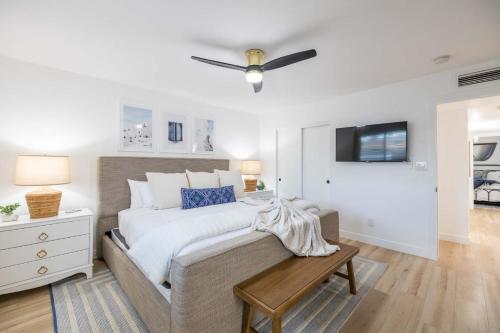 a bedroom with a large bed and a tv at Tempe Wesleyan in Tempe
