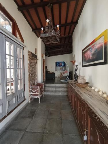 a hallway of a house with a chandelier at Casona Veroka in San Pedro