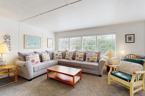 a living room with a couch and a table at 2nd Tee at Neskowin Village in Neskowin