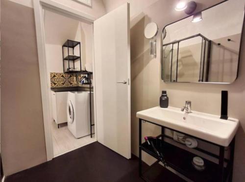 a bathroom with a sink and a mirror at La Casa di Rinaldo in Catania