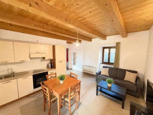 a living room with a table and a couch at Agriturismo Il Vecchio Scornabecco in Senigallia