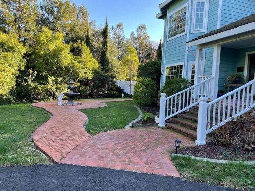a brick walkway in front of a house at Luxury Private Poolside Suite in Napa