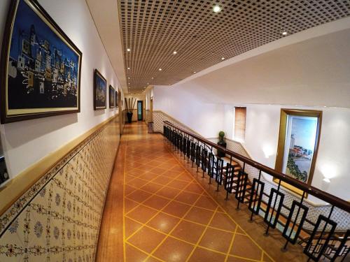 a hallway with a staircase in a building at Hotel Continental Luanda in Luanda