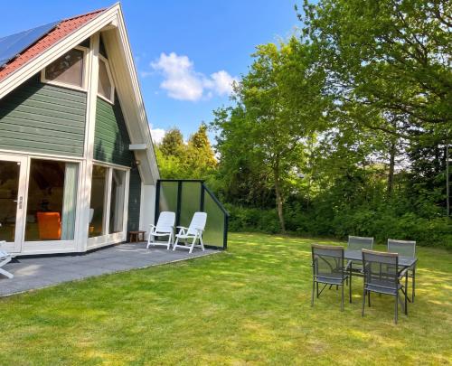 a group of chairs and tables on a patio at Utpuster in Lauwersoog