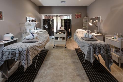 a salon with two beds in a room at Barceló Aruba - All Inclusive in Palm-Eagle Beach