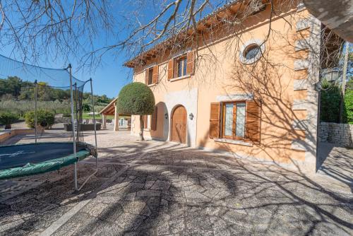 a house with a basketball hoop in front of it at Luxury Villa Es Molinet in Alcudia