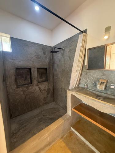 a bathroom with a shower and a sink at Pool, Space, Style, Modern House for 8 in Brisas de Zicatela