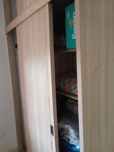 a closet with a door open with a box in it at PUEBlA in Marinilla