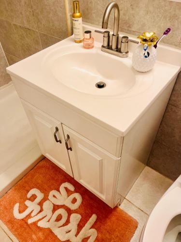 a bathroom sink with a towel on the floor at Bankston A in Marietta