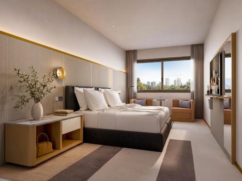 a hotel room with a bed and a large window at The Sebel Parramatta in Sydney