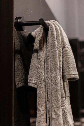 a robe is hanging on a door at Casa Del Toro in Barra de Navidad