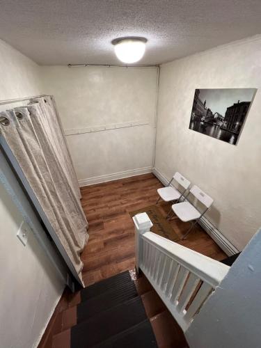 an empty room with two toilets and a staircase at Spacious 3BR Niagara Stay + Backyard in Niagara Falls